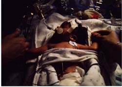 Mommy and Daddy holding Adam&rsquo;s hands for the first time 8 hours after birth